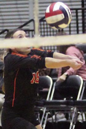 Keaton Walker saves a tipped ball in the first set. Sticker Photo By Darrell Vyvjala