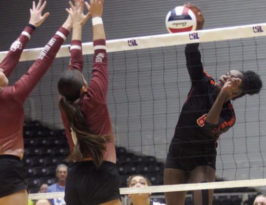 Jessalyn Gipson puts down a kill in the first set. Sticker Photo By Darrell Vyvjala