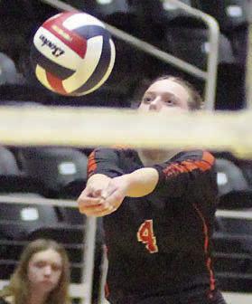 Avery Helms gets a dig in game three. Sticker Photo By Darrell Vyvjala