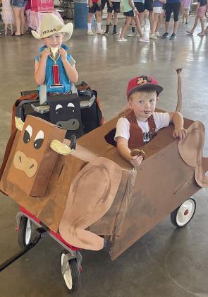 “Bull Riders” – Maverick and Roman Gooch.  Sticker Photo By Darrell Vyvjala
