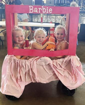 “Barbie” – Paisley, Harper, and Dawson Guentert.  Sticker Photo By Darrell Vyvjala