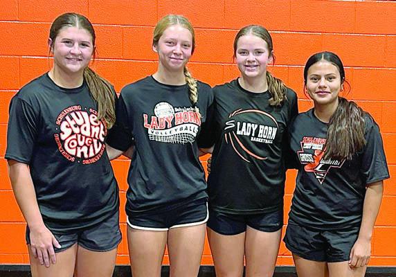 100 percent Front, from left: Landry Zapalac, Michaela Kollmann, Kerr McBride, and Ruby Cortez.
