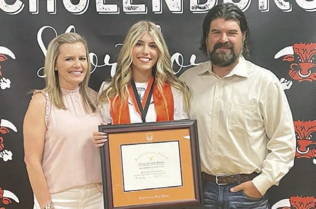 Chayse (center) was presented the salutatorian plaque with her parents, Kirsten and Daniel Deagen alongside her, at last Thursday’s Senior Scholarship Banquet. Sticker Photo By Darrell Vyvjala