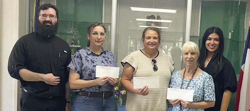 St. Michael Catholic School Teacher Grant – (from left) Fr. Chase Goodman, Traci Llanes, Ann Barlow and Sharon Johnson, with Melanie Ramirez, Stanzel Family Foundation program director.