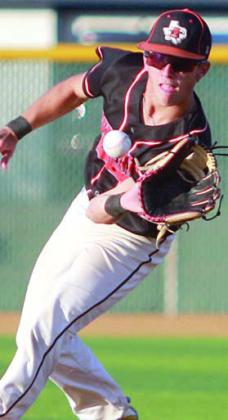 Second baseman Cooper Demel ranges to his left to field a grounder in game two. Sticker Photo By Darrell Vyvjala