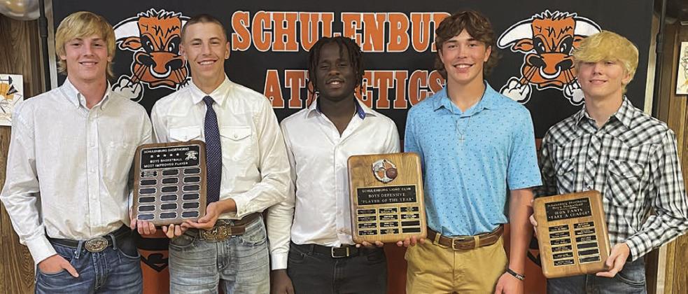 BOYS’ BASKETBALL – (from left) Zane Brenek and Van Prihoda, Most Improved Award; Rodney H. Walton and Jayse Janda, Defensive MVPs; and Nick Goode, Iron Pants Award. Not shown: Byron Johnson and Aaron Janecek, Co-Players of the Year. Sticker Photo By Darrell Vyvjala