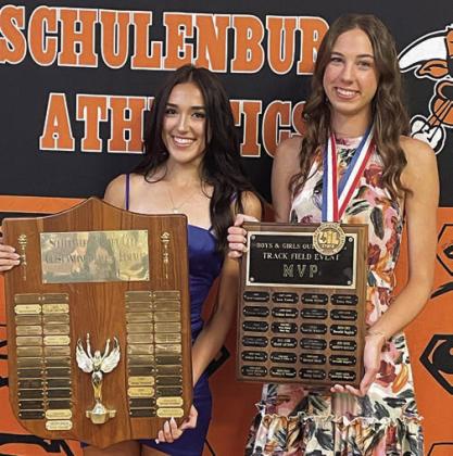 GIRLS’ TRACK – (from left) Makena Kopecky, Rotary Club Outstanding Female Track Athlete; and Meredith Magliolo, Field Event MVP. Sticker Photo By Darrell Vyvjala