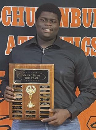 MANAGER OF THE YEAR – Rogerick H. Walton. Sticker Photo By Darrell Vyvjala