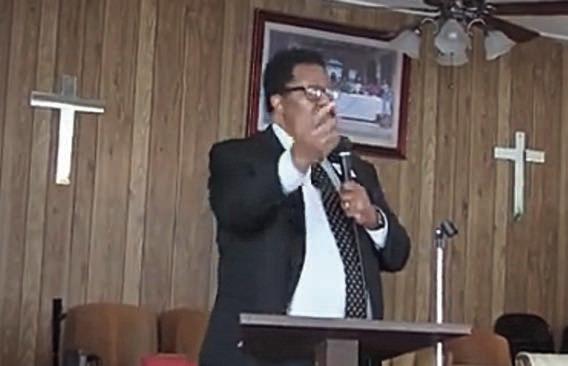 Distr ict Superintendent Dr. Marcus A. L. Freeman III is shown speaking inside the church.