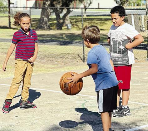 A favorite program for Boys &amp; Girls Club members at the Schulenburg Unit is Triple Play because it involves playing fun and active games such as Hoop Defenders. Shown are (from left) Club members Joshua Villanueva, Valdemar Pineda and Kayden Kehoe.