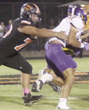 Marshall Wellborn chases down Huxton Kloesel in the first quarter. Sticker Photo By Layne Vyvjala