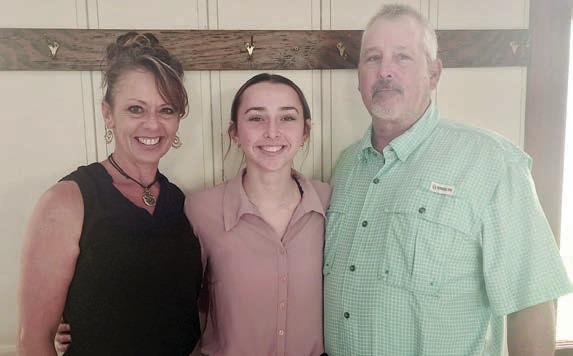 Scholarship winner Presley Sommer (center) with her parents Kimberly and Brian Sommer.