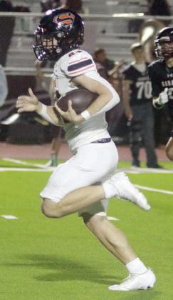 Mason Kunschick breaks into the open for a 36-yard touchdown run in the second quarter. Sticker Photo By Darrell Vyvjala