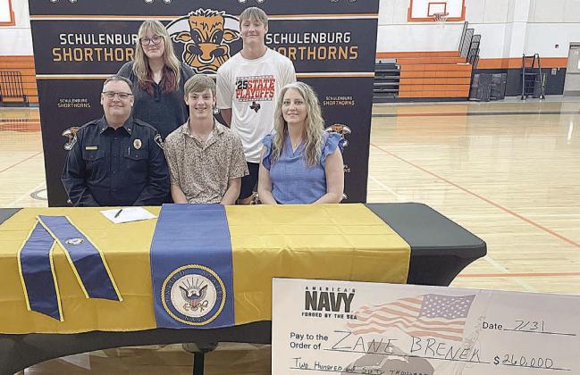 Zane Brenek signs U.S. Navy commitment.