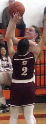 Kaylee Beyer drives past a Maiden for a basket in the second period. Sticker Photo By Darrell Vyvjala