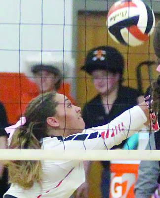 Kieryn Adams lunges for a dig in the third set against the Lady Comanches.