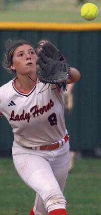 Shortstop Jordin Davis charges in to snag a soft line drive against Ganado. Sticker Photo By Darrell Vyvjala