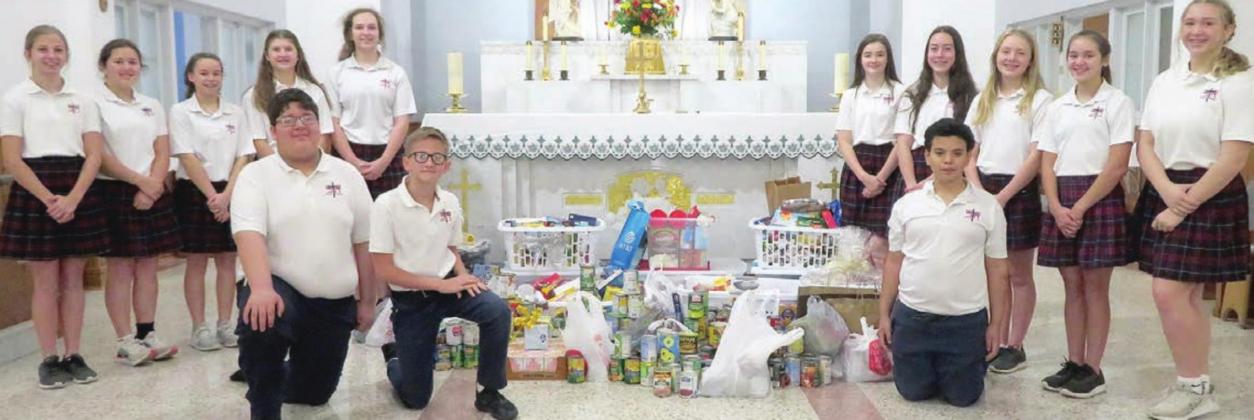St. Rose donates to Food Pantry, Family Crisis Center at Thanksgiving Mass
