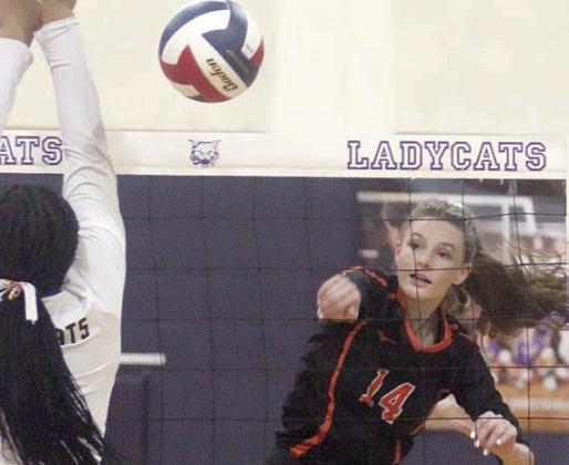 Emmrie Marx sends a kill down the line in the third set against Weimar. Sticker Photo By Darrell Vyvjala