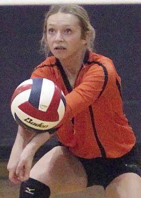 Michaela Kollmann gets one of her 25 digs in the Weimar match in the second set. Sticker Photo By Darrell Vyvjala
