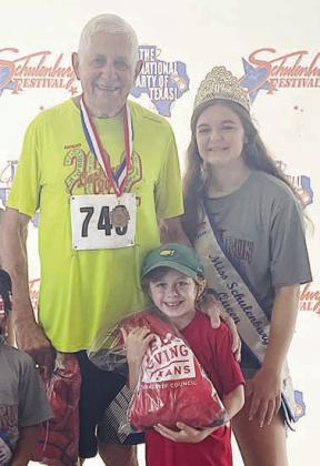 ‘Most Seasoned’ &amp;amp; Youngest – Lee Miksch (back, left) and 6-year-old Dean Brier (front). Also pictured is Miss Schulenburg Riley Zapalac. Sticker Photo By Darrell Vyvjala