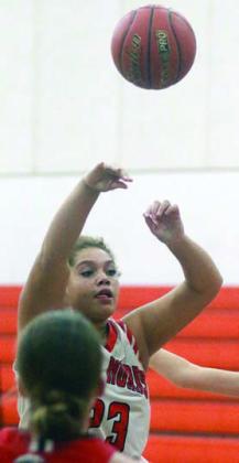 Arianna Vincent dishes to a teammate for a fourth-quarter bucket against Brazos. Sticker Photo By Darrell Vyvjala