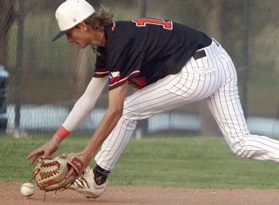 Third baseman Connor Lichnovsky stays with a hard-hit grounder for the final out against Bloomington. Sticker Photo By Darrell Vyvjala