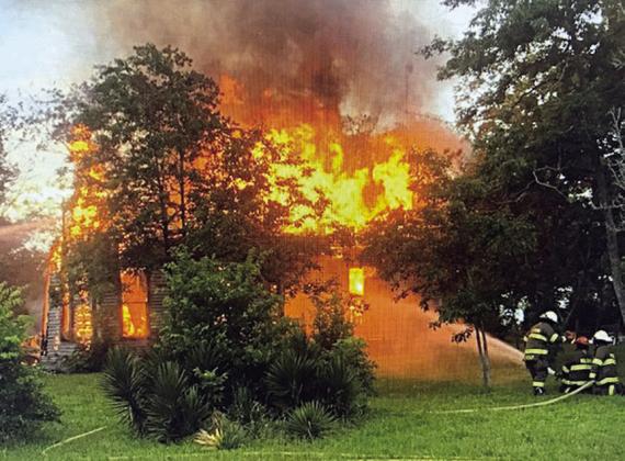 A two-story structure at Cistern was engulfed by fire on Monday, May 15, with personnel from the Muldoon Volunteer Fire Department assisted by Flatonia Fire &amp;amp; Rescue working the scene for about five hours. Photo Courtesy of Fayette County Sheriff's Office