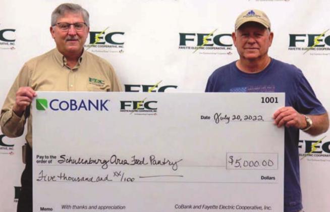 Schulenburg Area Food Pantry receiving its $5,000 grant. Shown are (from left) Fayette Electric Cooperative General Manager Gary Don Nietsche; and Jack Niesner, Schulenburg Area Food Pantry vice president.
