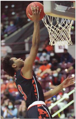 Bryce Wilson soars to the hoop for a score in the third quarter. Sticker Photo By Kade Vyvjala