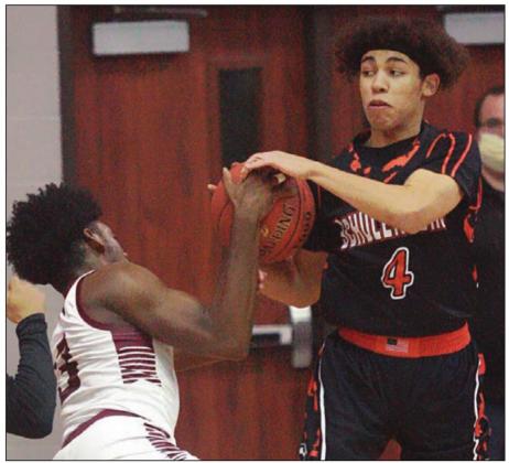 Jalen Wilson rips the ball away from Cadarian Wiley in the first half. Sticker Photo By Kade Vyvjala