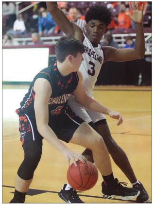 Jayson Schaefer muscles his way to the basket in the second half. Sticker Photo By Kade Vyvjala