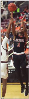 Bryce Wilson goes up for two of his 30 points in the state semifinal game last week. Sticker Photo By Kade Vyvjala