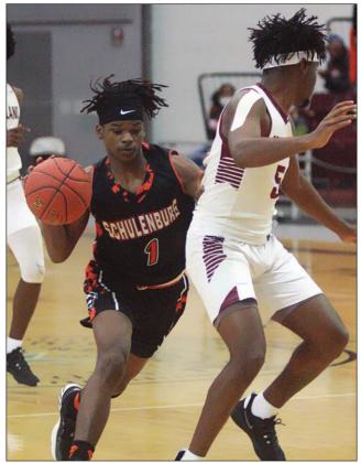 Kenny King drives past B.J. Lamb. Sticker Photo By Kade Vyvjala