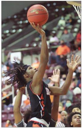 Kenny King goes up for a bucket in the third quarter.  Sticker Photo By Kade Vyvjala