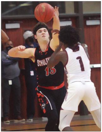 Brett Janecek tips the ball away from Michael Dancer in the second half.  Sticker Photo By Kade Vyvjala