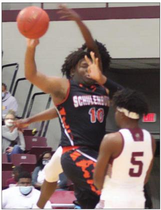 T.J. Speed dishes to a teammate. Sticker Photo By Darrell Vyvjala
