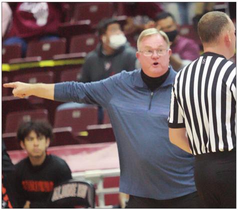 Head coach Richard Hoogendoorn makes his point to one of the referees early in the fourth quarter.  Sticker Photo By Kade Vyvjala