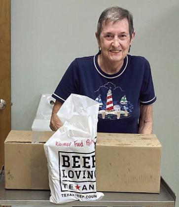 Presentation to Weimar Food Pantry – Evelyn Thuemler, pantry volunteer, received the donation from Dani Stock, NVCW volunteer.