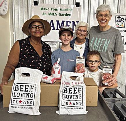 Presentation to La Grange Area Ministry for Emergenc y Needs (AMEN) – Jacqueline Figg (left), NVCW pantry donation chair; Zoe Justiss (back, second from right), NVCW volunteer; and Susan Schultz (right), AMEN vice president.