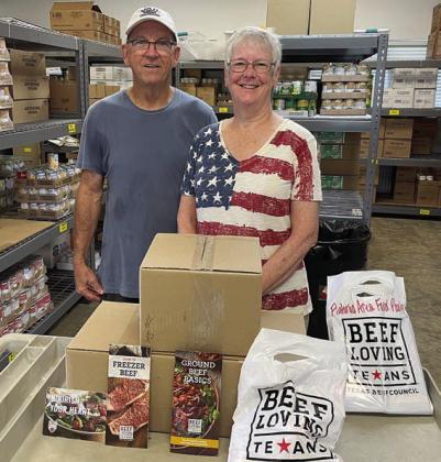 Presentation to Flatonia Area Food Pantry – (from left) Larry Haas, president of Flatonia Area Food Pantry, and Jackie Harker, NVCW secretary.