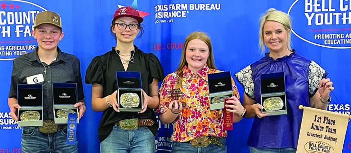 Champion Junior Team – (from left) Holden Holub, Tatum Fritsch, Kaisley Janecka, coach Kaci Carrales and (not shown) Abraham McBride. Holden Holub and Abraham McBride are members of the Schulenburg 4-H.
