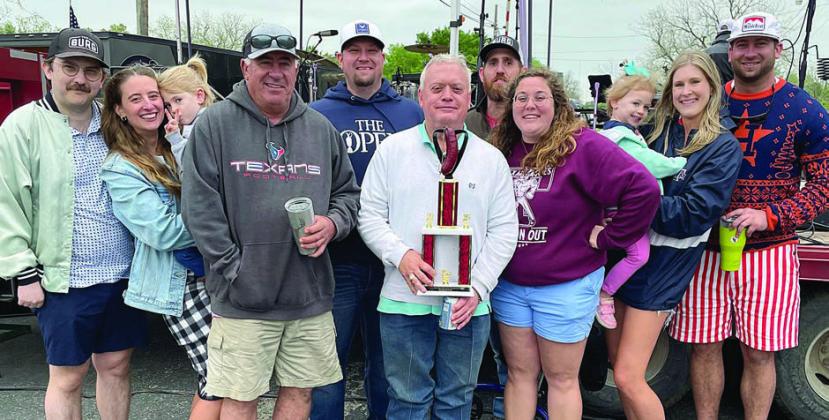 “ALL IN THE FAMILY” – (from left) Dustin and Carah Schiffli (holding Caroline Willey, Tim Havrda, Ryan Besetzny, Jackie Machac, Scott Willey, Allison Machac, Anna Koscielniak (holding Malynn Willey), and Ryan Havrda. Sticker Photo By Darrell Vyvjala