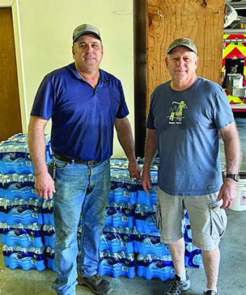 350 pounds of water was donated to the Schulenburg Volunteer Fire Department. Shown are (from left) are Darren Guentert, fire chief, and Jack Niesner SAFP volunteer.