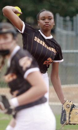 Third baseman Jashiya Jackson fires to first base to get an out against St. Paul. Sticker Photo By Darrell Vyvjala