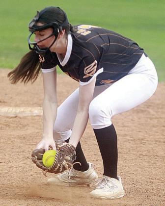 Second baseman Ava Faith scoops up a Lady Cardinal grounder for an out Friday morning. Sticker Photo By Darrell Vyvjala