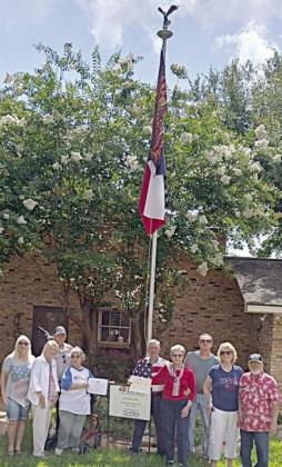 At the Richard and Gail Heffley residence in Columbus are DAR and SAR members along with the flag display honorees – (from left) Wanda Anglin, Judy and Dave Zachmeyer, Nelma Strey, honorees Richard and Gail Heffley, Glen Strey, and Stephanie and Rick Mattix.