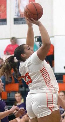 Arianna Vincent (above) hits a shot in the paint in the first quarter Saturday night. Sticker Photo By Darrell Vyvjala