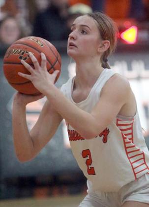 Miranda Bonner lines up the second of two free throws to seal the win over Shiner. Sticker Photo By Darrell Vyvjala