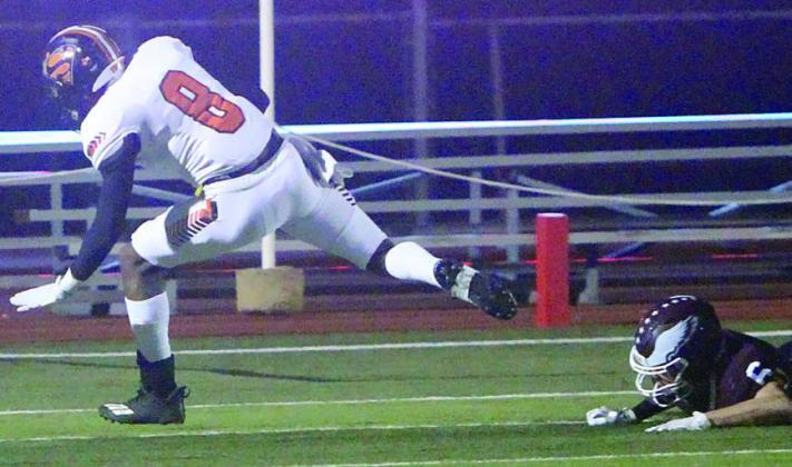 Da’Terrion Houston gets tripped up inside the 10-yard line but not before he returned a kickoff 98 yards to set up a touchdown in the second quarter. Sticker Photo By Darrell Vyvjala